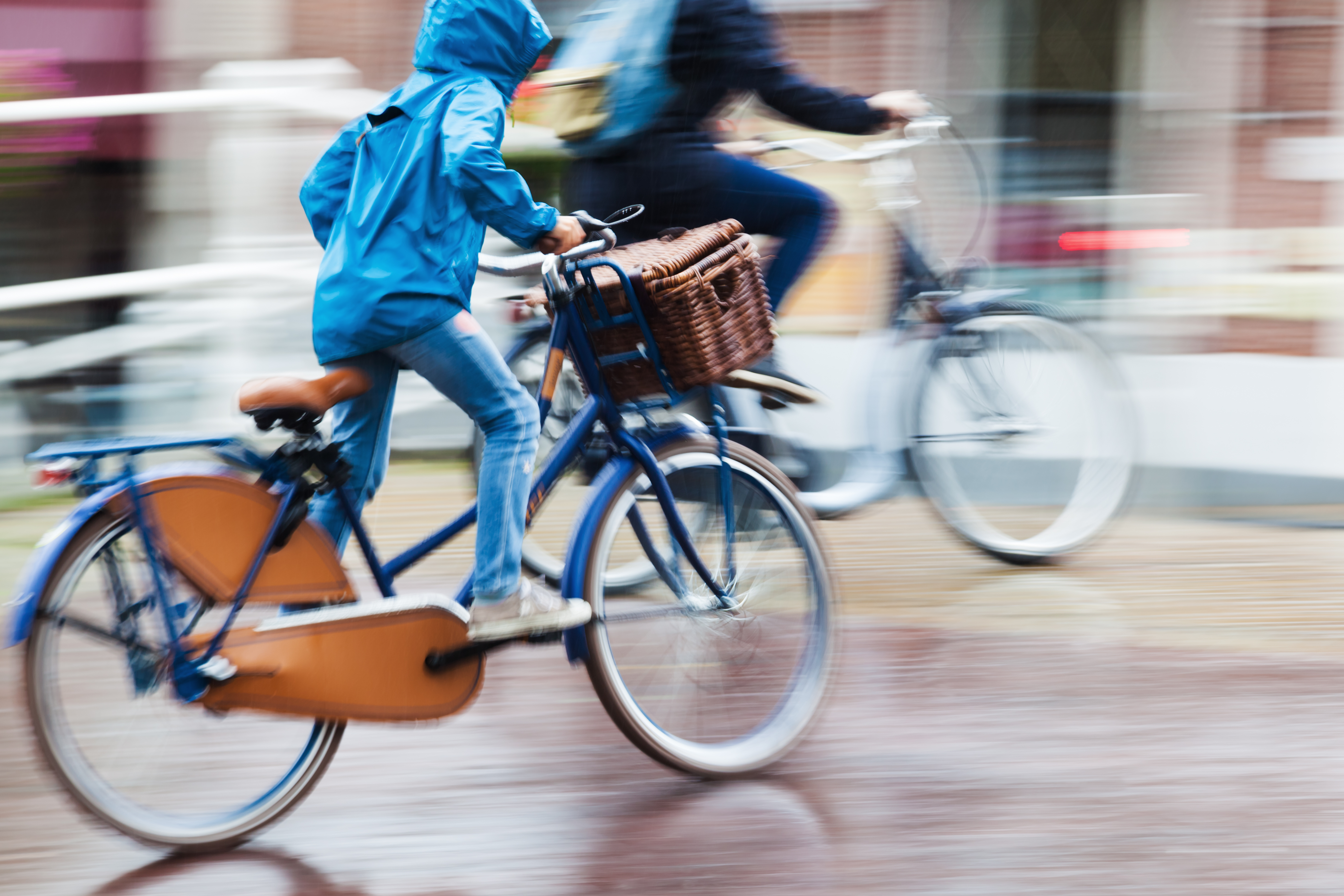 Riding bikes in the rain. Photo: Shutterstock