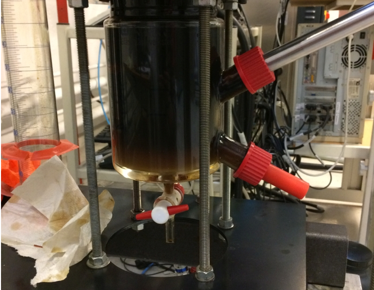 An experimental tank cell facility for measuring emulsion dynamics in a crude oil-water flowing system with an inserted probe camera.