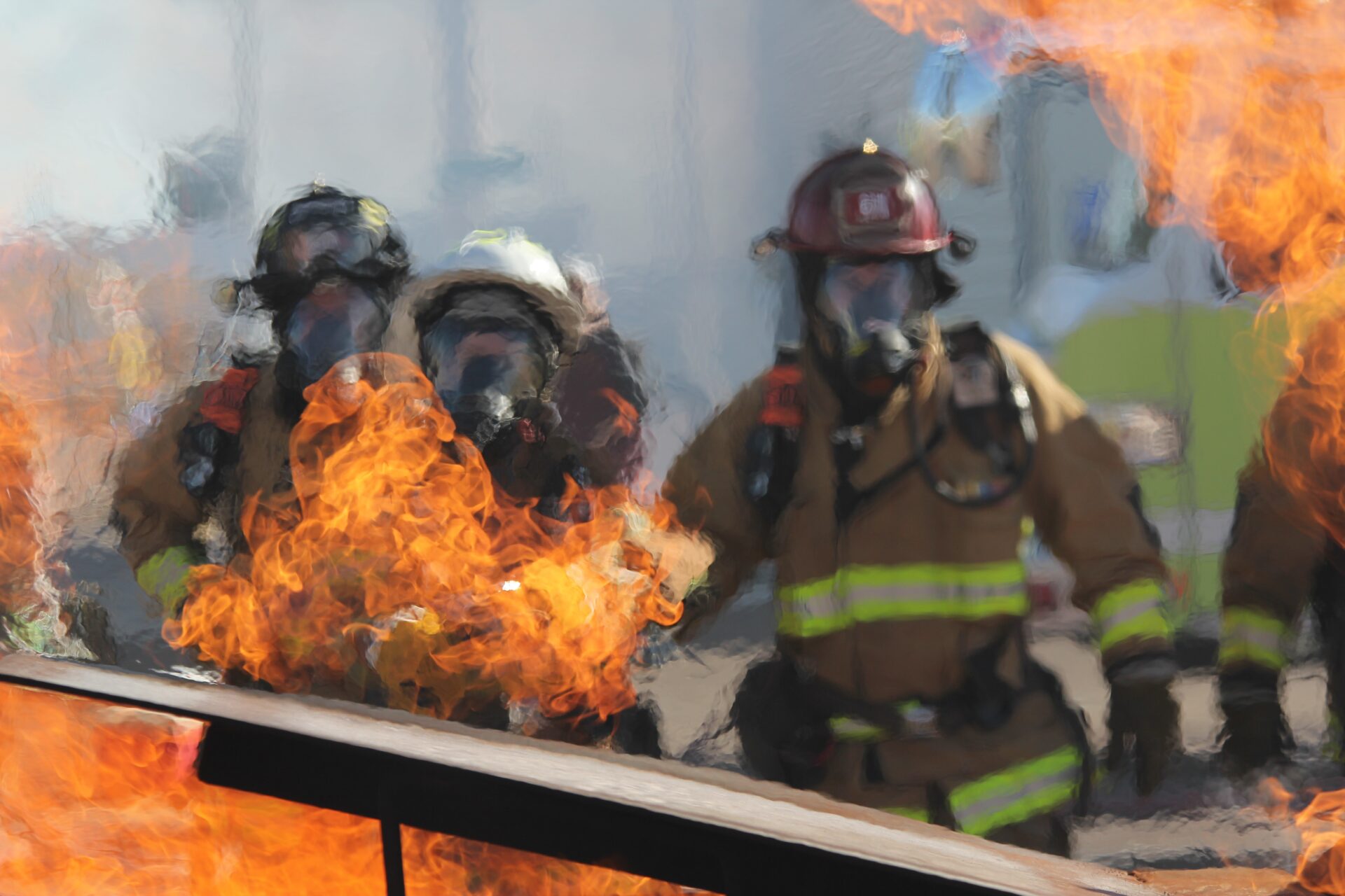 Three fire fighters and a fire