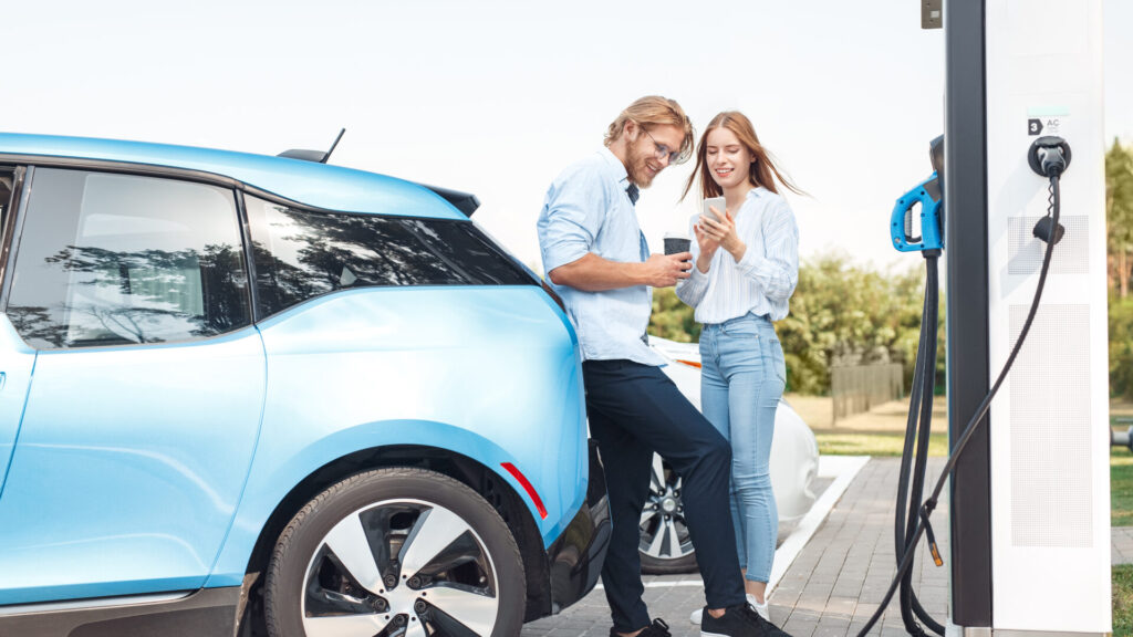 couple charging an electric car