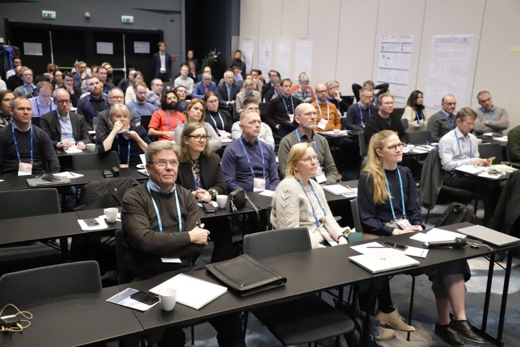 Participants in the LowEmission consortium days, listening to presenters.